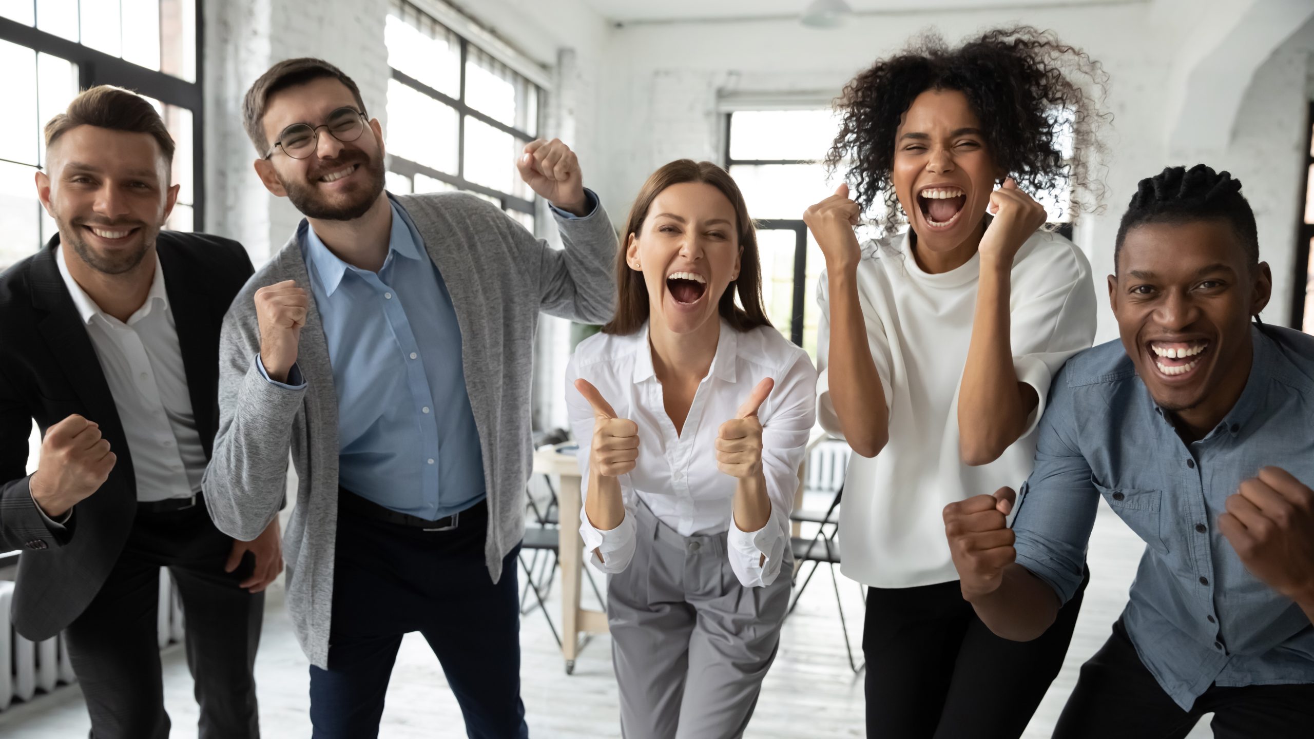 Portrait,Of,Overjoyed,Young,Diverse,Employees,Workers,Show,Thumb,Up